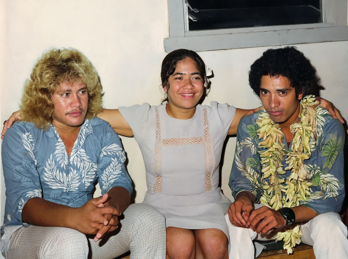 restored photo of the month of june of 3 people sitting