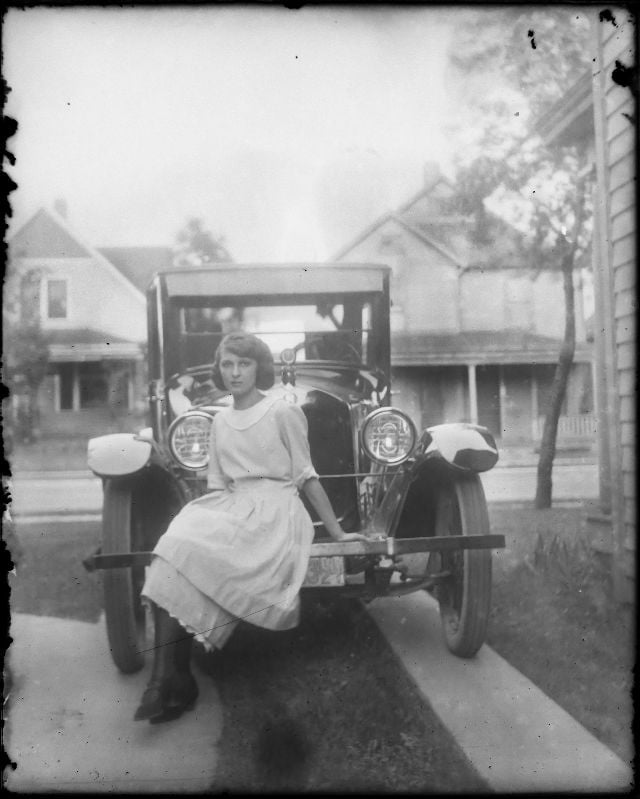 The Art of Revival: Understanding the Different Levels of Photo Restoration 1 original photo for photo restoration of young lady sitting on a car